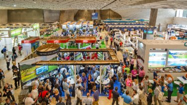 people walking down the exhibition hall